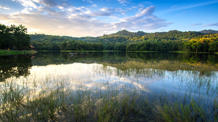 beautiful sunset on the reservoir , reflection of cloud , landscape thailand