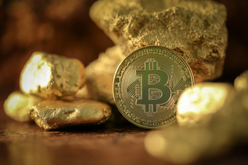 Gold bitcoin physical and Gold nugget grains. Concept mining cryptography