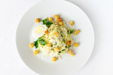 white cabbage salad with chicken and parsley served with mayo based sauce decorated with egg,...