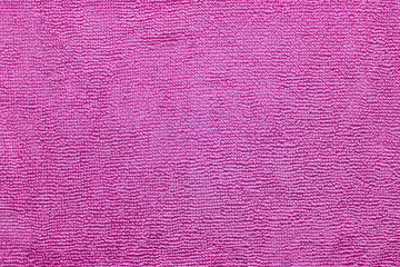 Pink fiber fabric texture abstract background closeup