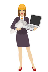 Businesswoman in construction helmet holding the project plans and a laptop notebook