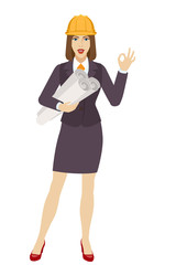 Businesswoman in construction helmet holding the project plans and showing a okay hand sign
