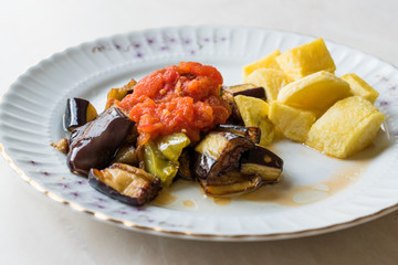 Turkish Food Kizartma / Fried Aubergine or Eggplant Slices with Tomato Paste Salsa Sauce and Cube Potatoes.