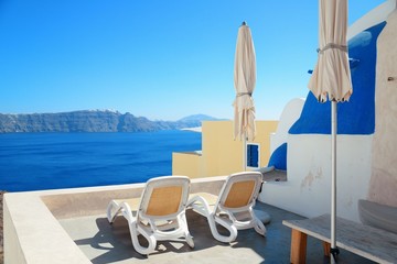 Fototapeta premium Santorini island leisure life with chair and umbrella