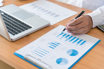 businessman working plan the business and analysis many chart graph