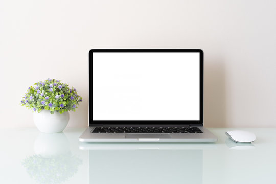 Conceptual workspace, Laptop computer with blank white screen isolated on white background
