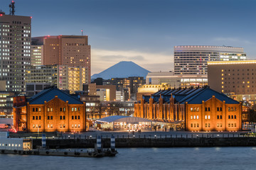 Yokohama red brick warehouse with Top of Mt. Fuji in background. The Yokohama Red Brick Warehouse,...