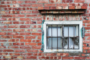 Aged brick wall and old window