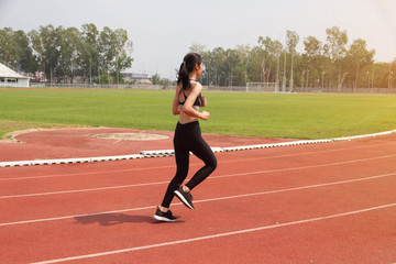 Fototapeta premium Asian woman sport runner in track stadium 
