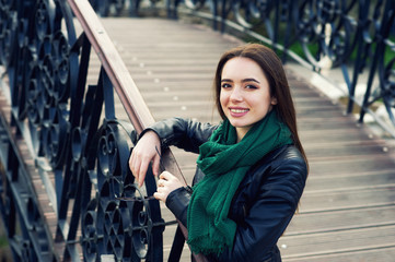 Portrait of a young woman in the city. The girl in the leather jacket . Casual urban clothing