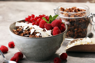 granola healthy breakfast with natural yogurt, muesli and berries