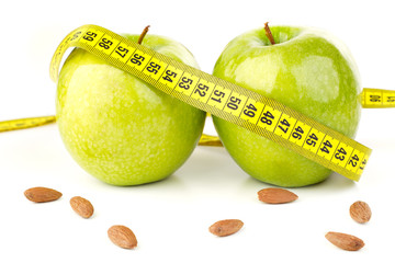 ripe green apples and a tape measure