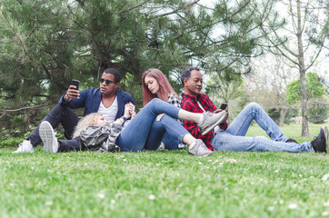 Group of diverse hipster friends using smart phone