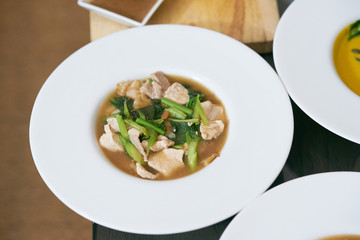 Fried noodle with pork and broccoli on isolated white background top view, called in thai 