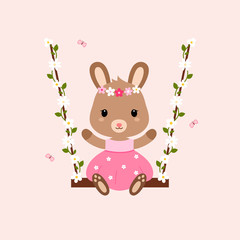 Cute bunny sitting on the swings.