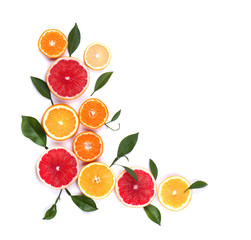 Fototapeta na wymiar Citrus fruits isolated on white background. Isolated citrus fruits. Pieces of lemon, pink grapefruit and orange isolated on white background, with clipping path. Top view.