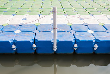 Plastic pontoon with the rope fence.