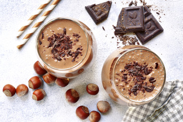 Homemade chocolate banana nut smoothies with ingredients for making.Top view .