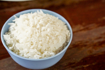 White rice on the table wood