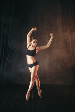 Classical ballet dancer in black practice training