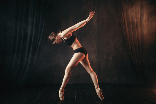 Classical ballet dancer in black practice training