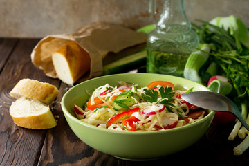 Healthy vegetarian bowl. Summer vegetarian vitamin salad with fresh vegetables. The concept of healthy and dietary nutrition.