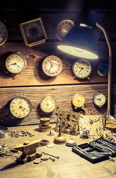 Old watchmakers workshop full of clocks and tools