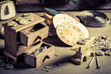 Small watchmaker's room with spare parts of clocks