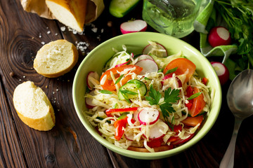 Vegan dish. Proper nutrition. Healthy lifestyle. Summer vitamin salad with fresh vegetables dressing olive oil.