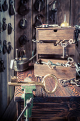 Fototapeta na wymiar Locksmiths workshop with old keys and locks