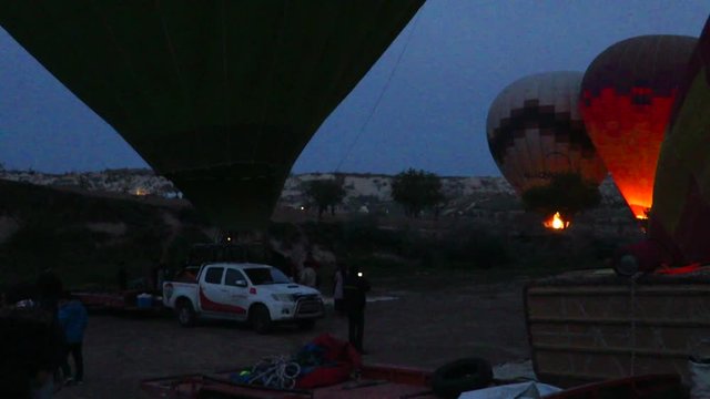 Inflating a Green Hot Air Balloon in Cappadocia