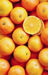 A lot of mandarin orange  in the market  with full frame and Photo vertical