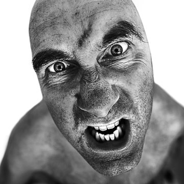 Black and white portrait of mad man processed using the dragan effect.
