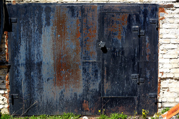 Black rusty garage doors.