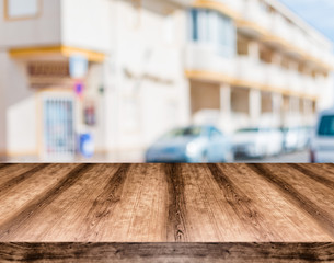 Wooden empty table board in front of blurred background. Can be used for display or montage any product. Mock up for display your product.