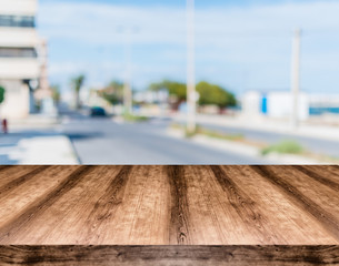 Wooden empty table board in front of blurred background. Can be used for display or montage any product. Mock up for display your product.