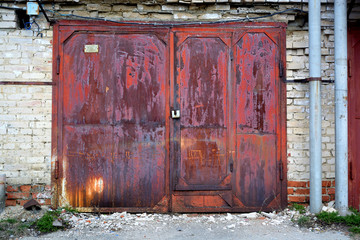 Rusty red-brown garage doors.