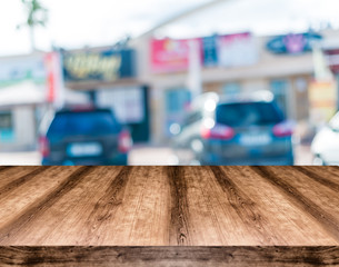 Wooden empty table board in front of blurred background. Can be used for display or montage any product. Mock up for display your product.