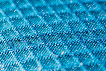 Blue 3d texturised technological seamless breathing fabric closeup.