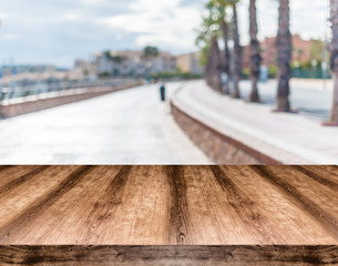Wooden empty table board in front of blurred background. Can be used for display or montage any product. Mock up for display your product.