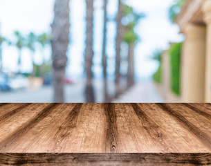 Wooden empty table board in front of blurred background. Can be used for display or montage any product. Mock up for display your product.