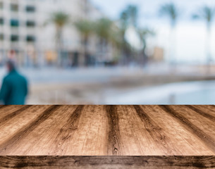Wooden empty table board in front of blurred background. Can be used for display or montage any product. Mock up for display your product.