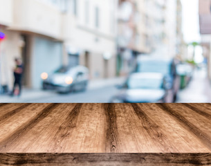 Wooden empty table board in front of blurred background. Can be used for display or montage any product. Mock up for display your product.