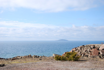 Fototapeta na wymiar Island by a rocky coast