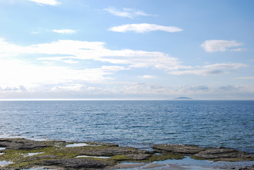 Fototapeta na wymiar Flat rock coast in the Baltic Sea