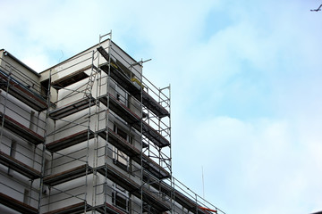Steel scaffolding placed outside the high building for its renewal.