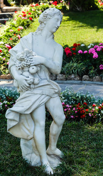 Antique figures in the public garden Giardino De Augustus (Augustus Gardens)  Capri, Italy