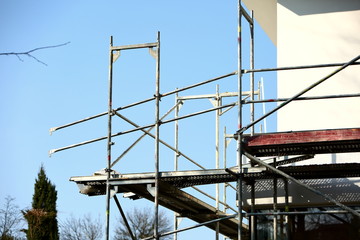 Steel scaffolding placed outside the high building for its renewal.
