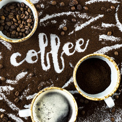 A cup of fresh hot coffee with foam, a cup of ground and a cup of coffee beans next to the word "coffee" written on the ground coffee,