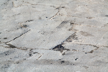 Damaged asphalt road.